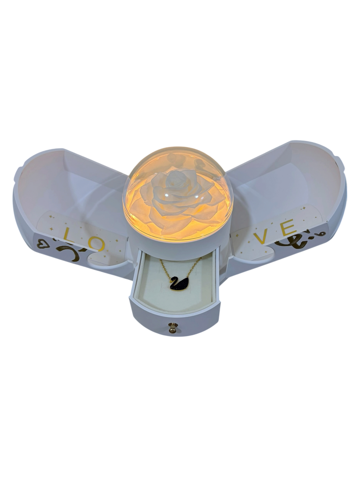 Ivory Beginning: white fold-open gift box with a lit preserved rose and plated jewelry drawer