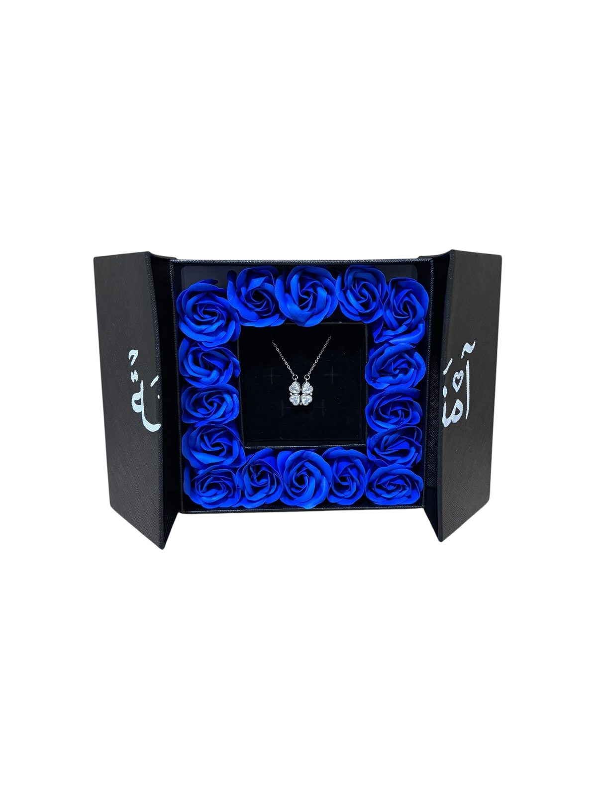 Cobalt Midnight: sixteen royal blue preserved roses packed edge to edge in a matte black gift box