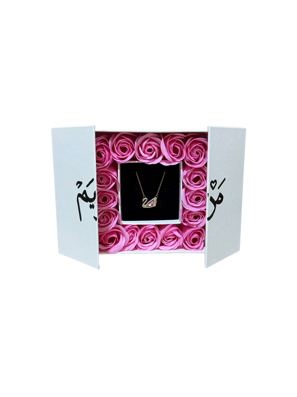 Rosewater: sixteen pale pink preserved roses packed edge to edge in a white gift box