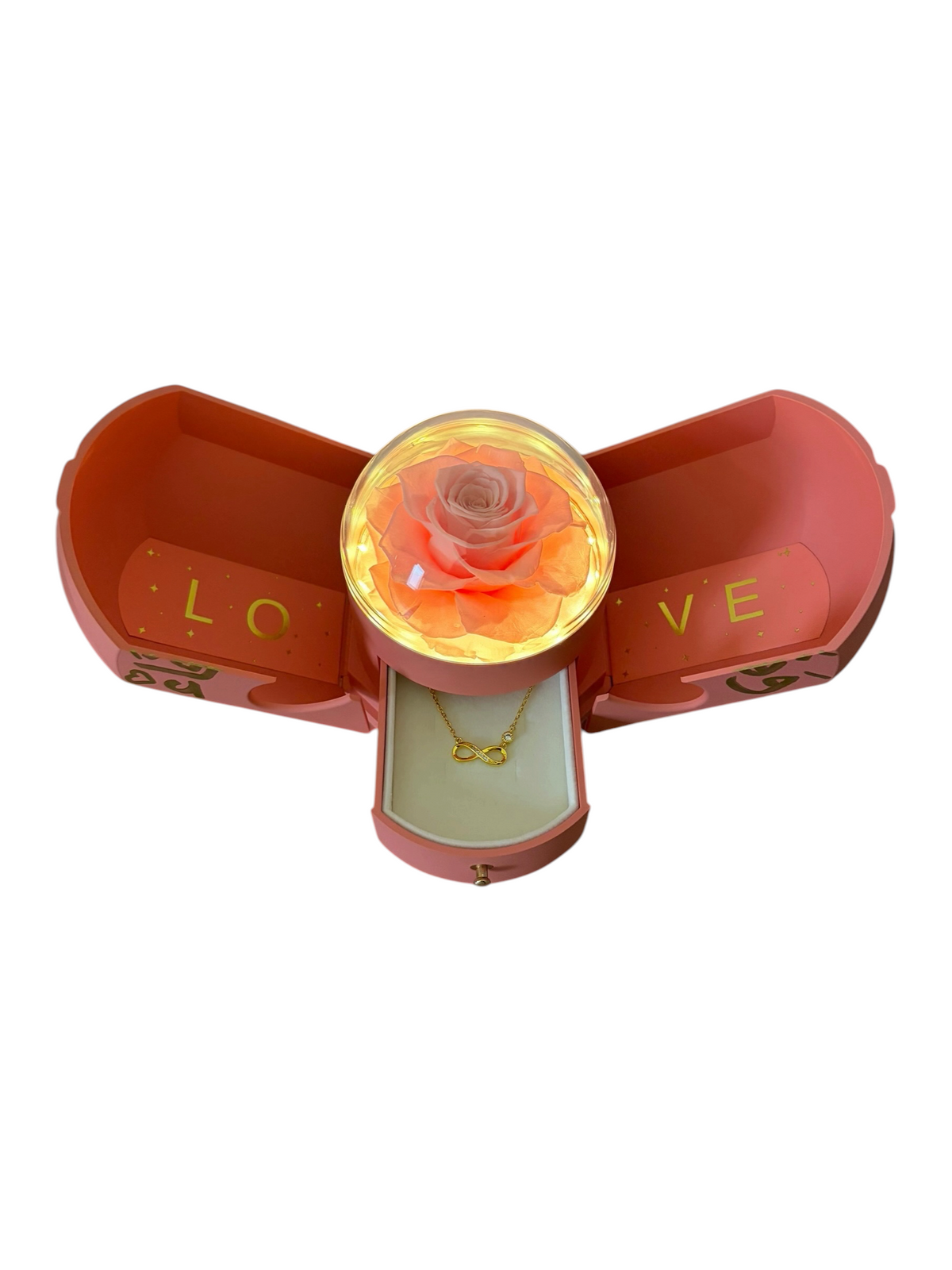 Love Reveal Blush: pink fold-open gift box with a lit preserved rose and plated jewelry drawer